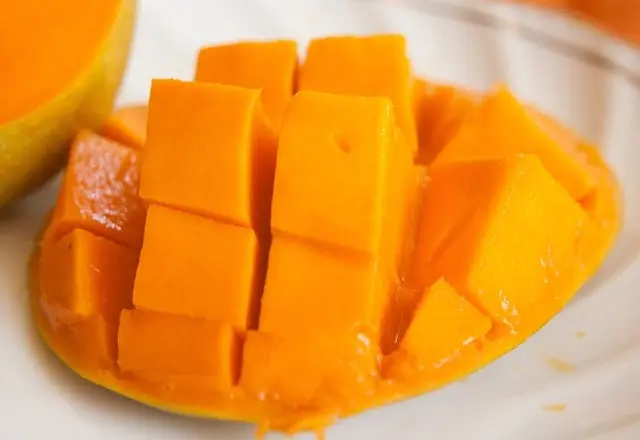 Sliced mango with pit removed